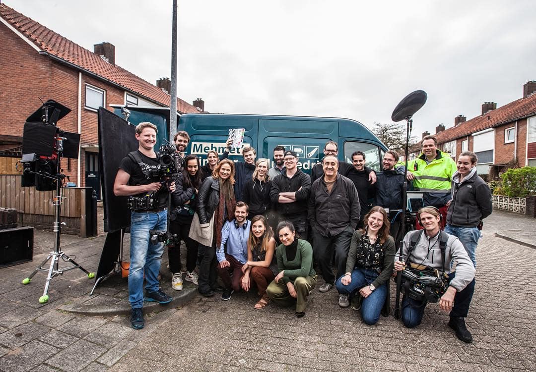 Creative video production team outdoors.