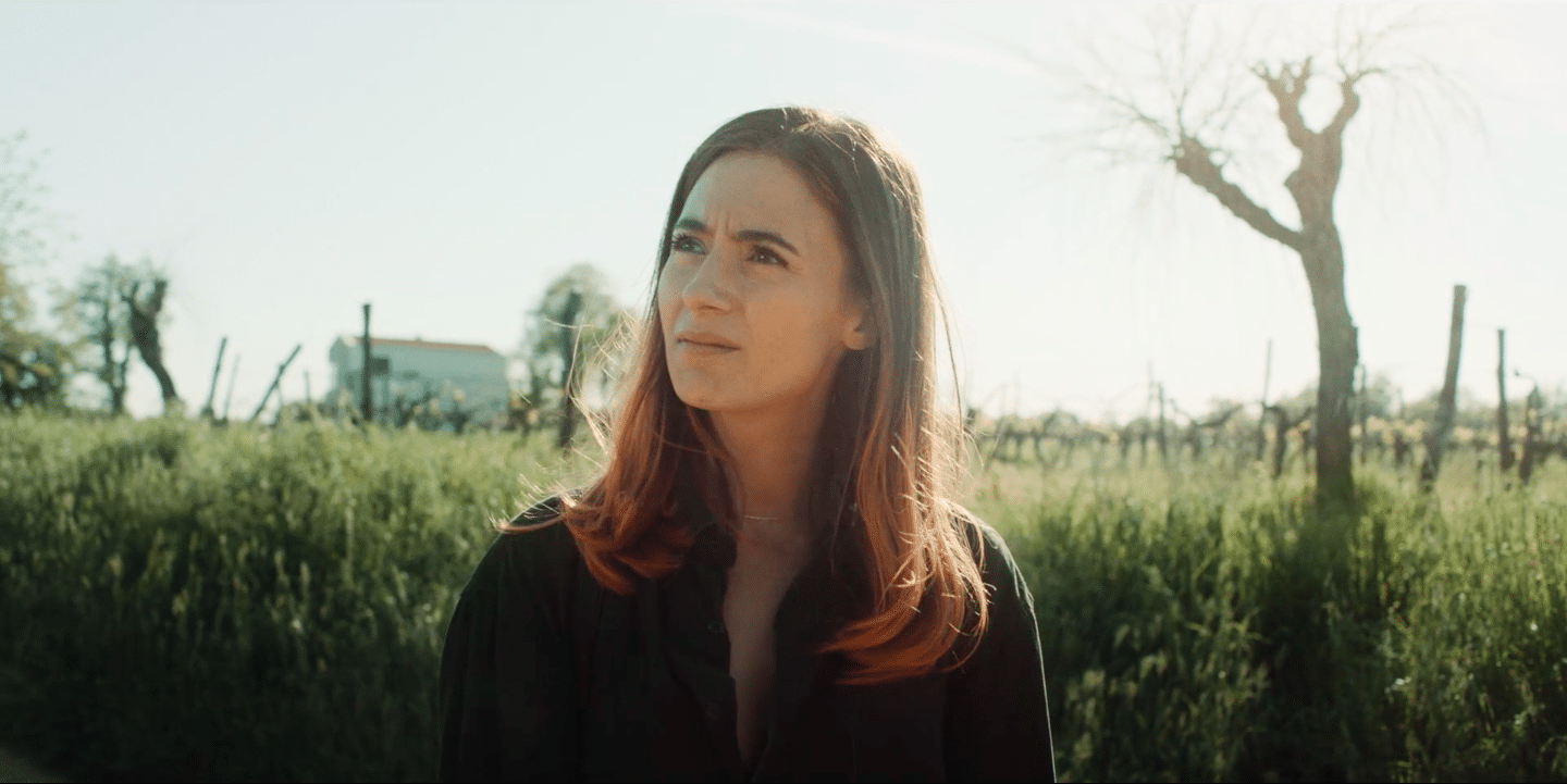 Woman outdoors in natural light, representing creative video production.