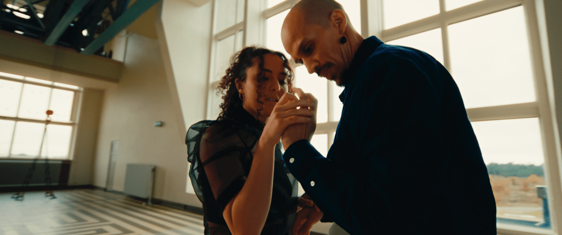 Two people collaborating on a creative project in a modern studio.