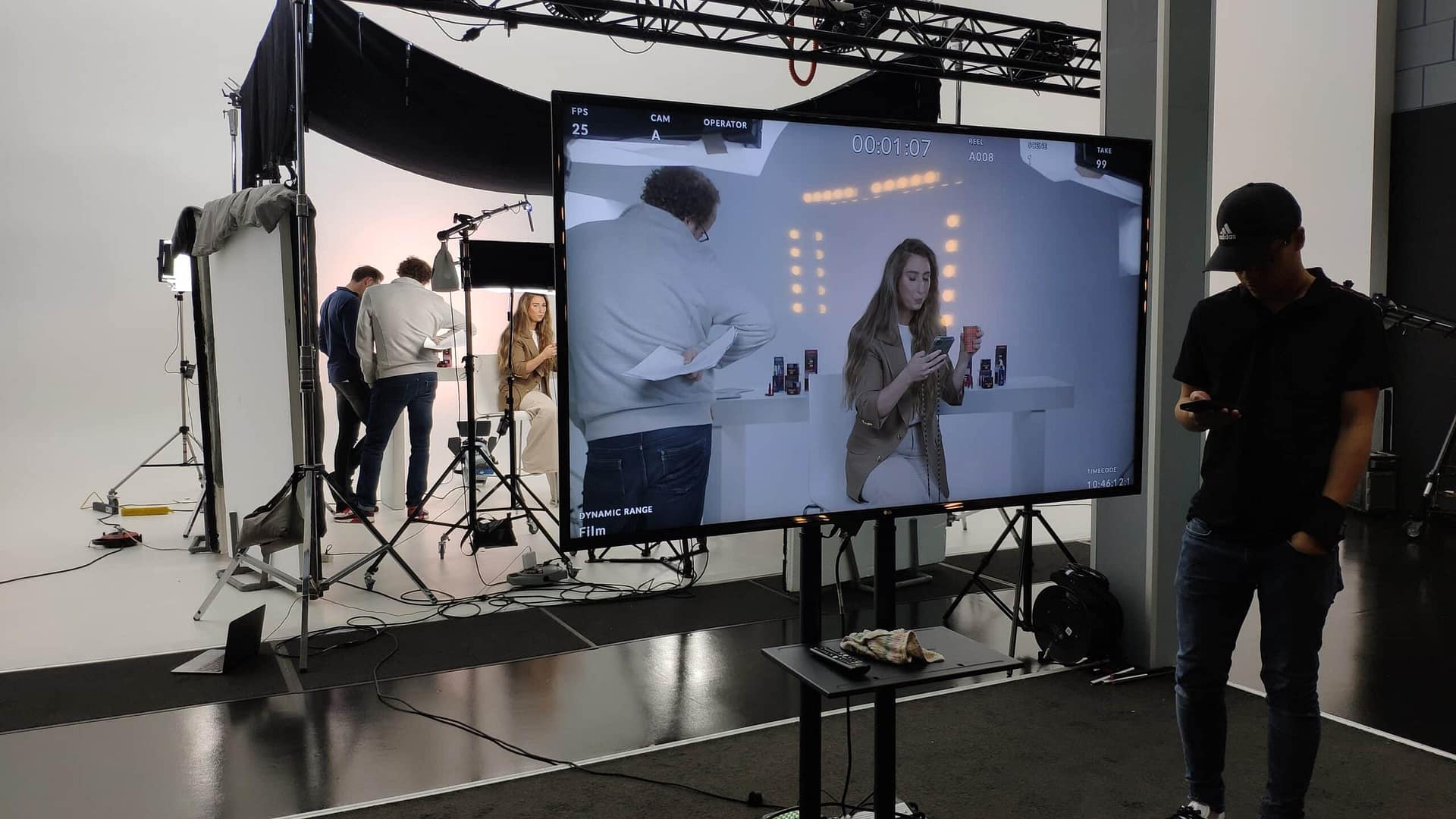 Modern video production studio with crew preparing for shoot.