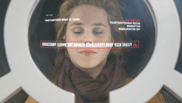 Woman lying inside a washing machine drum, symbolizing self-reflection and inner exploration.
