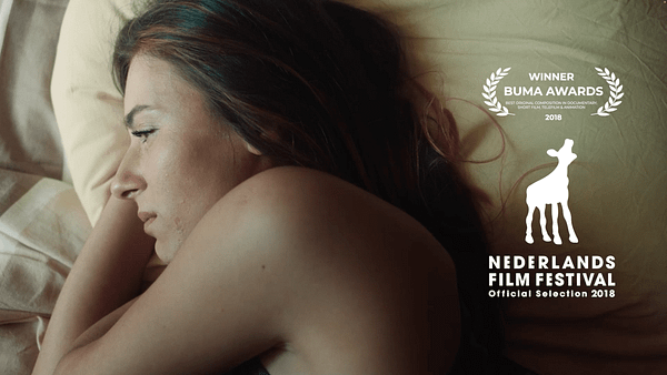 Woman sleeping peacefully in bed during summer, natural light.